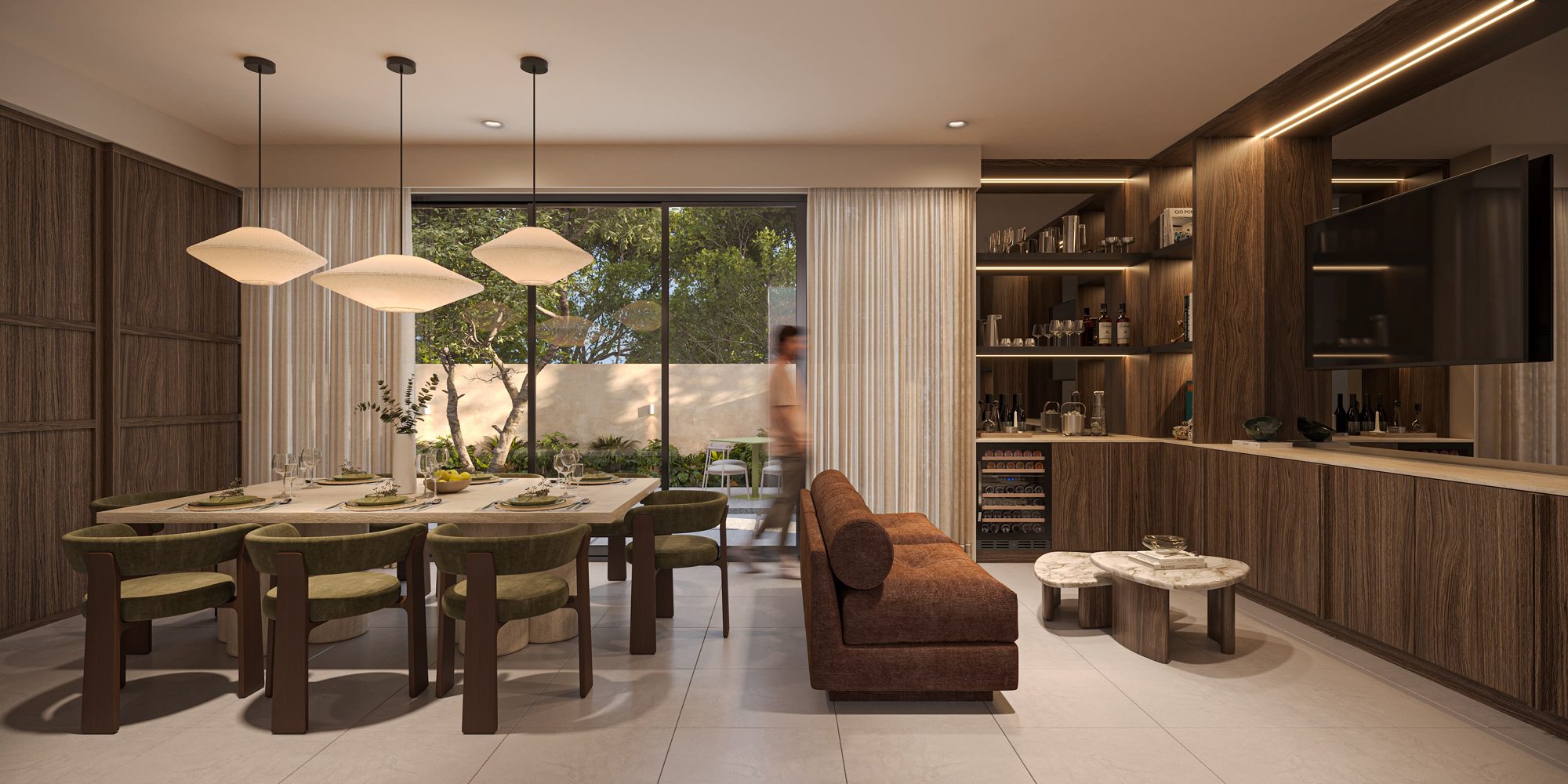 Dining and lounge with olive velvet chairs and walnut bar