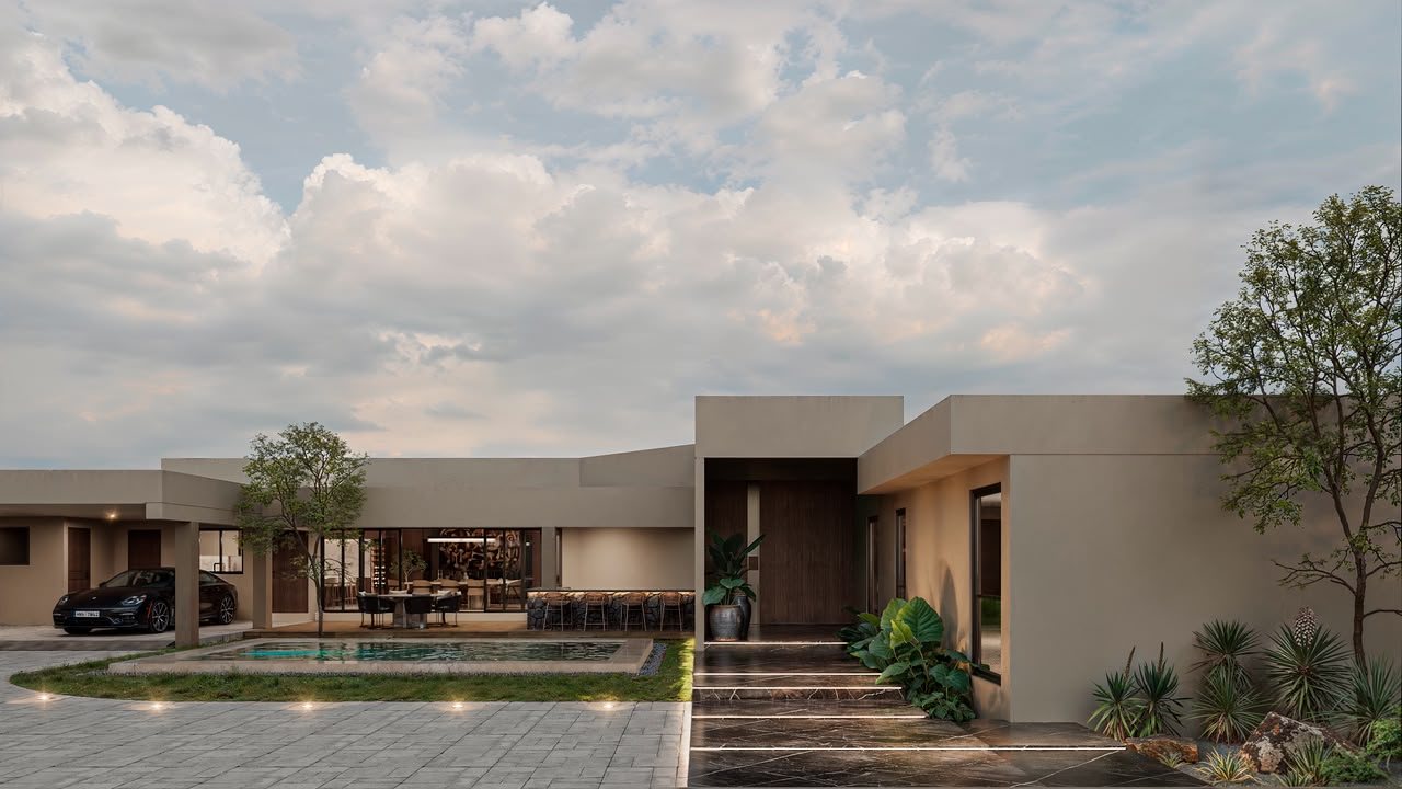 Single-story residence with pool and lit entry path at dusk