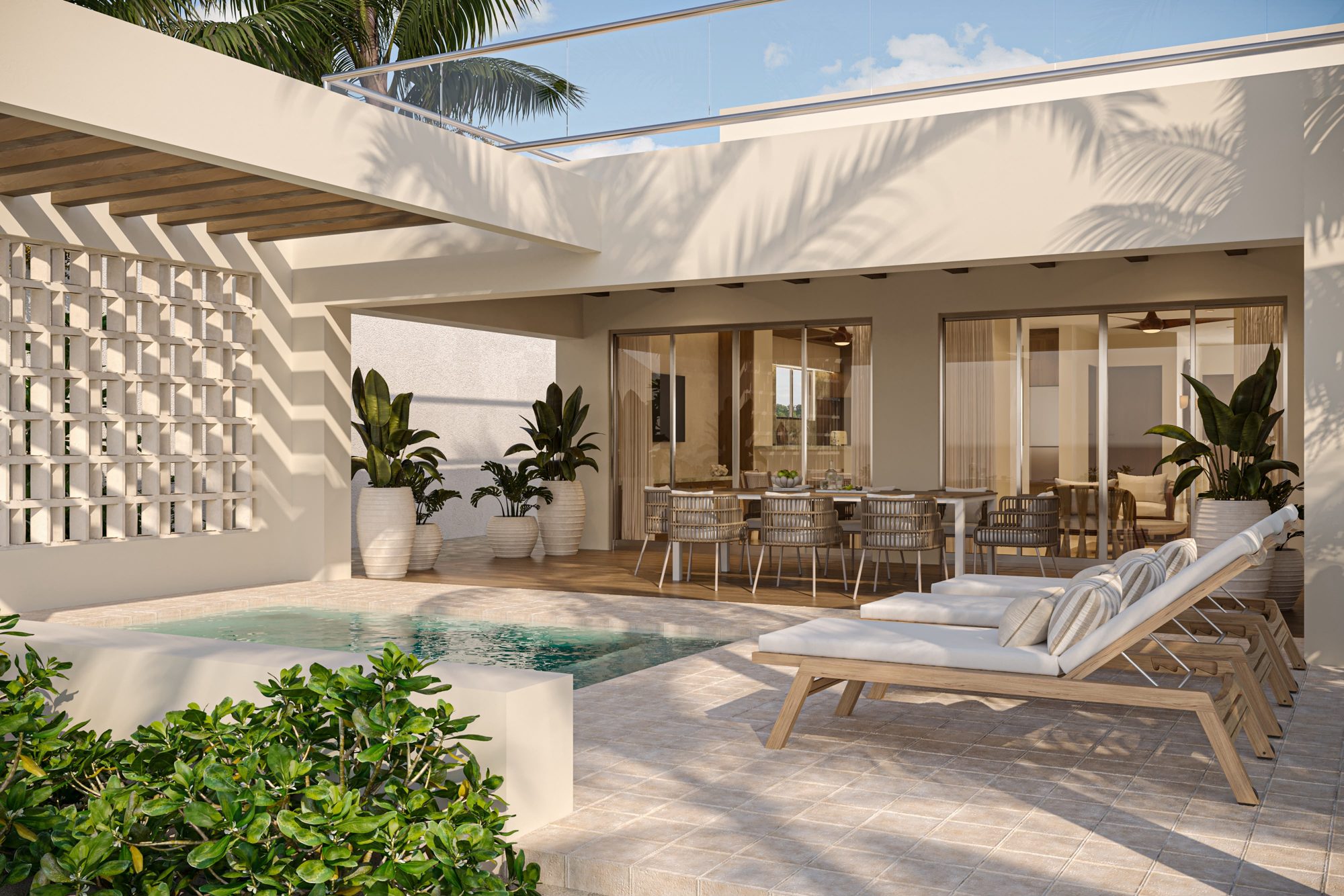 Pool terrace with sun loungers and breeze-block screen